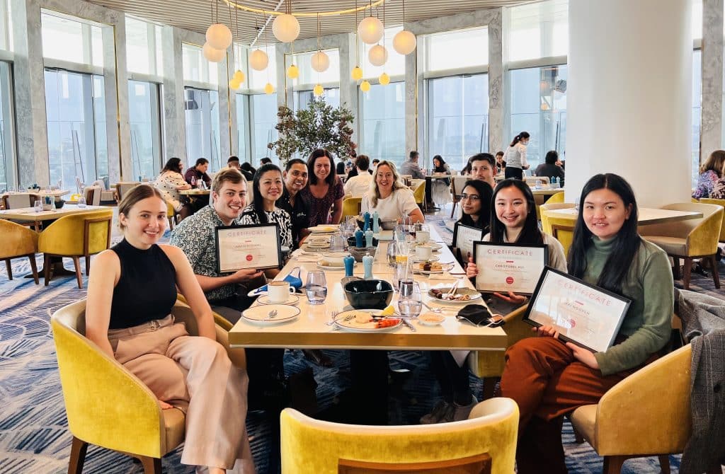 SYSTRA Graduates at table