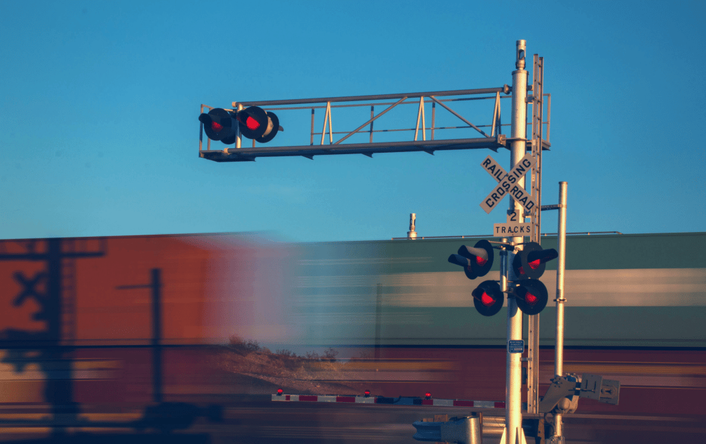 Freight train passing through signal
