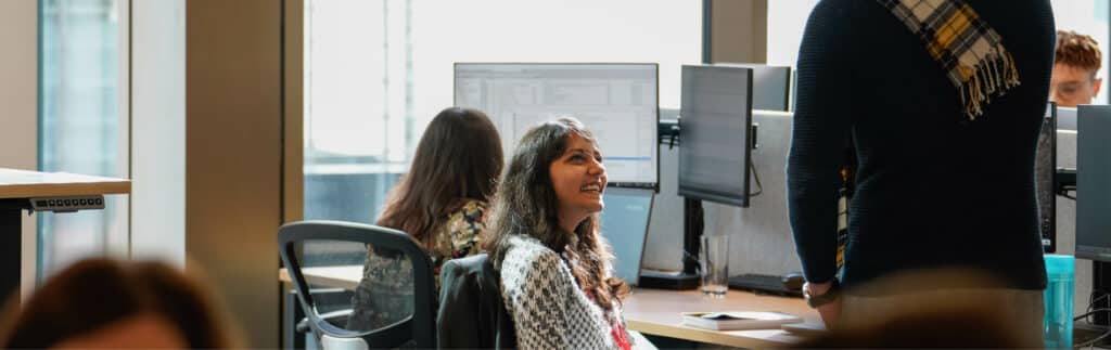SYSTRA staff talking in Manchester office