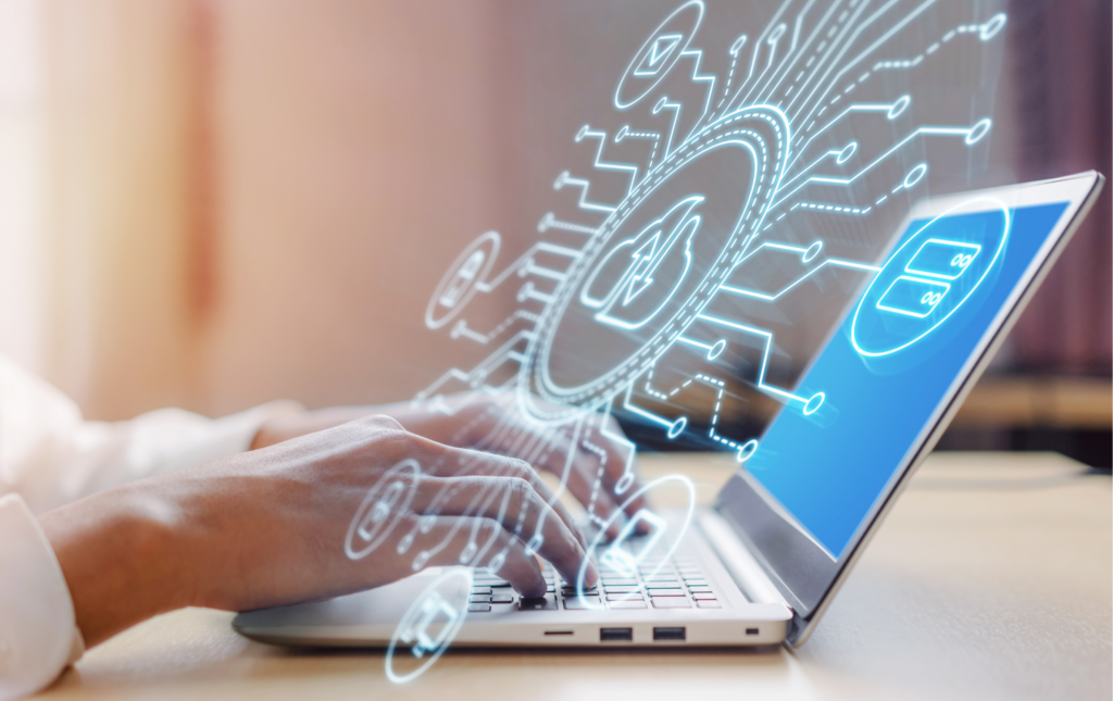 Hands typing on a laptop with a blue screen. In the foreground are digital icons floating, as if they are coming out of the screen.